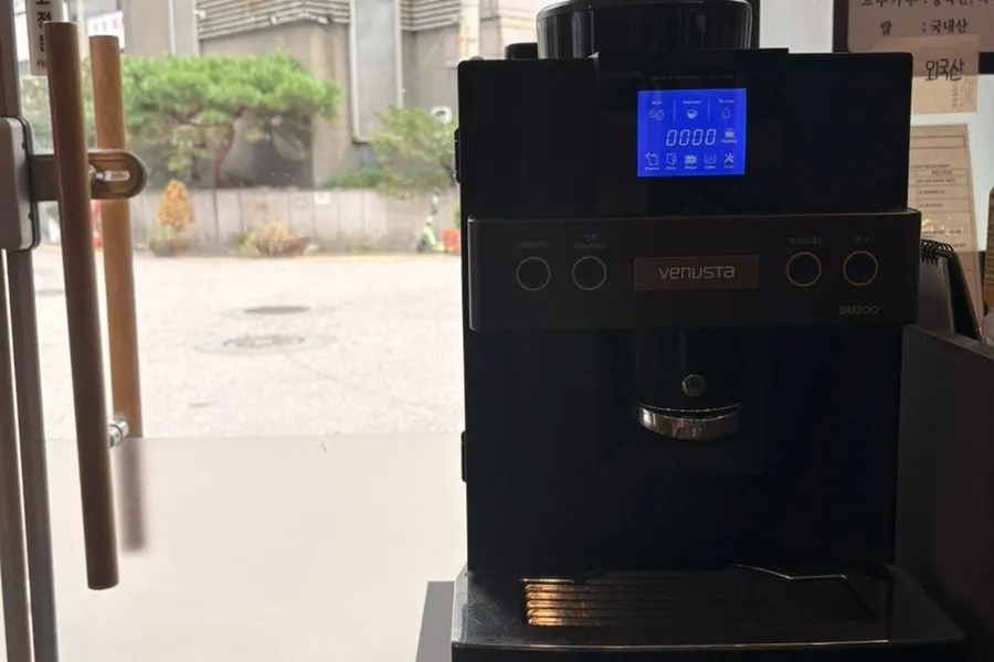 Coffee machine near the restaurant entrance