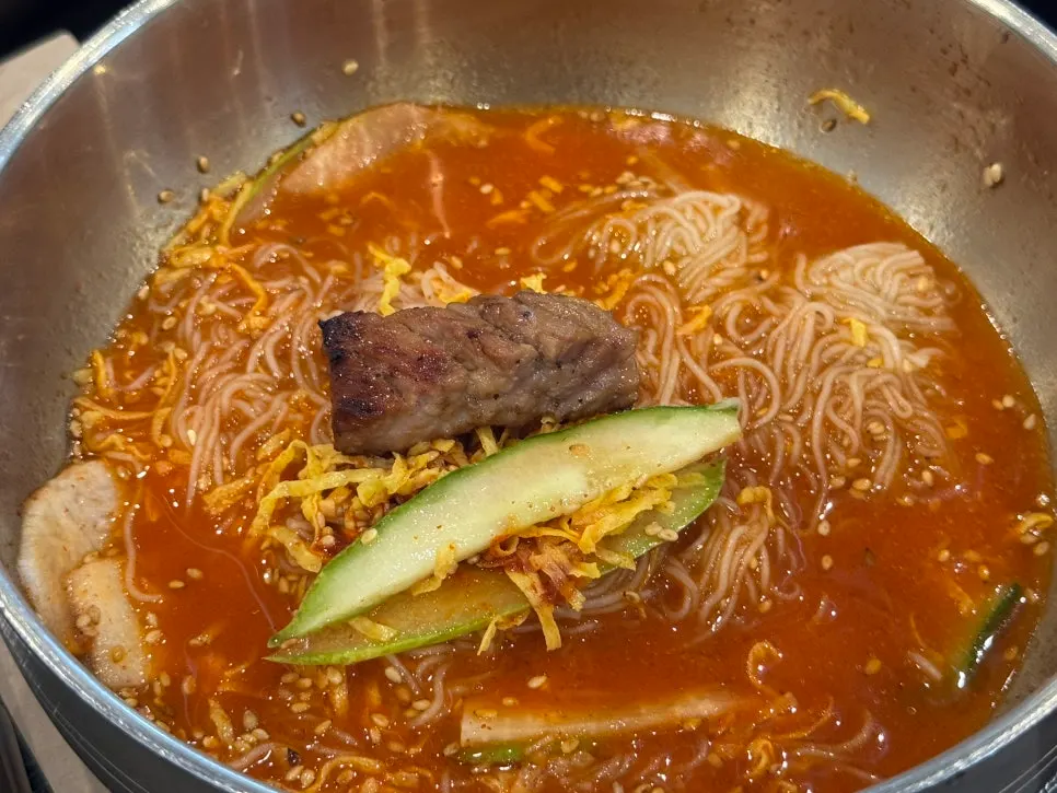 Free Hamhung naengmyeon eaten alongside grilled meat