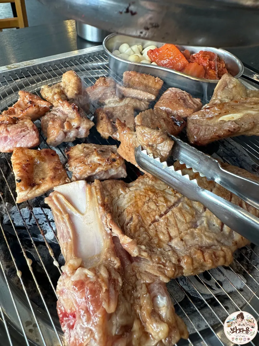 Final bite of galbi placed on top of cold noodles