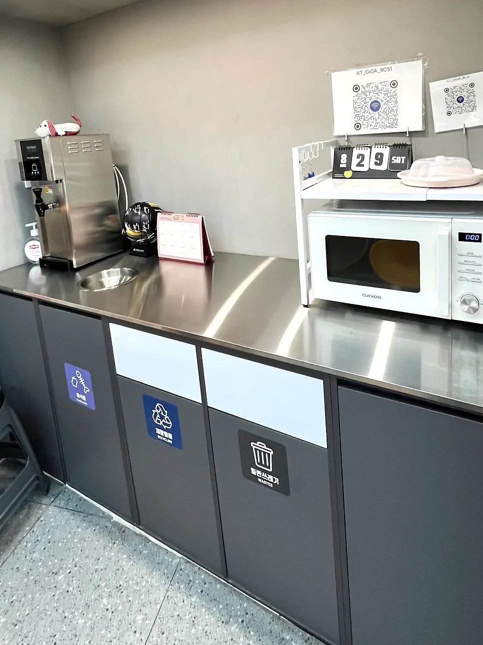 Corner of the shop with microwave and seating