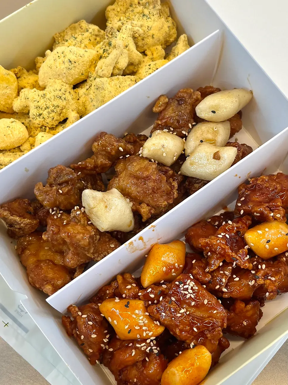 One and a half chickens packed into a takeout container