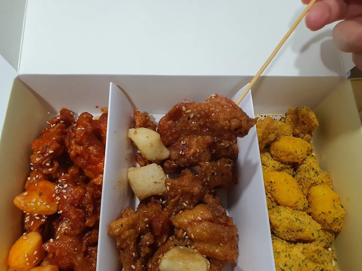 Sweet, Garlic Soy, and Bburinkle dakgangjeong laid out at home