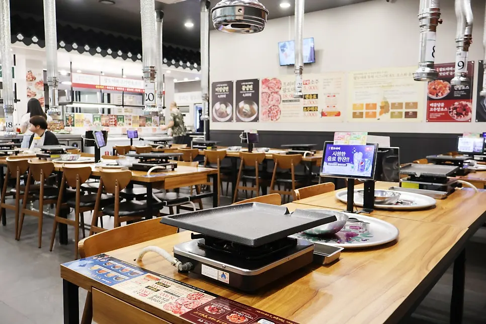 Dining hall seating with generous space between tables