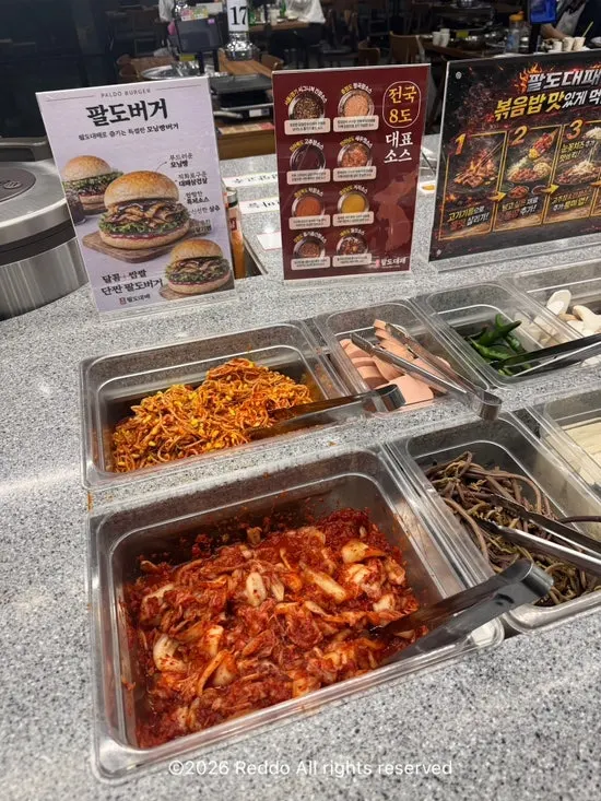 Self-serve bar with perilla leaves, lettuce, and other wrap greens