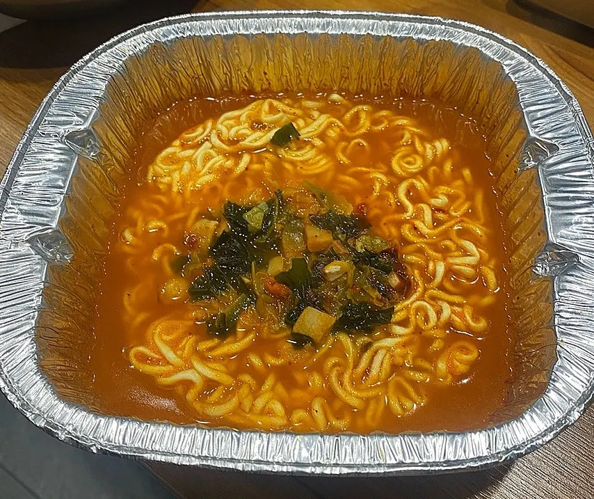 Ramen served alongside the meat spread