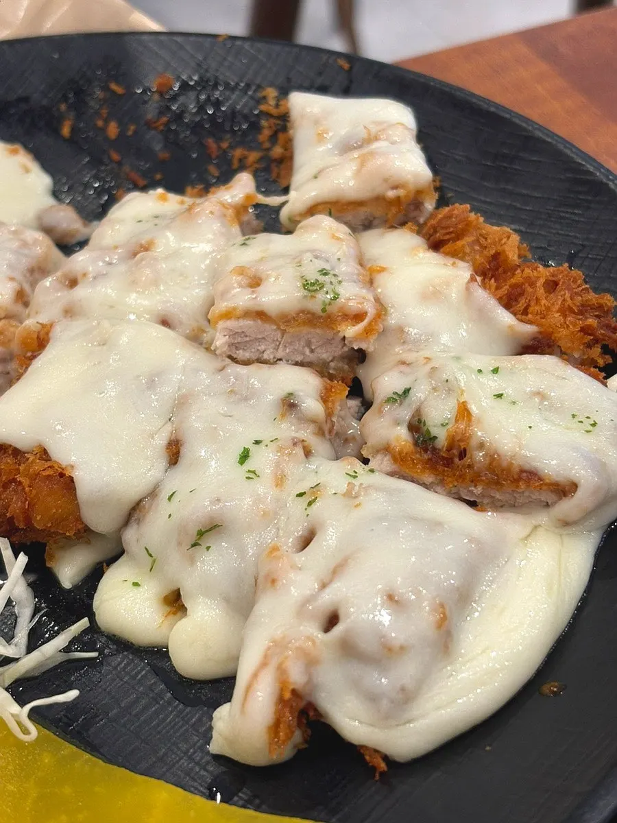 Cross-section of cheese donkaseu showing crispy breading