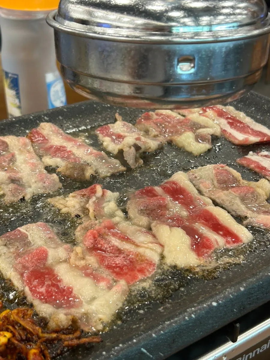 Pork wrap dipped in gochujang sauce
