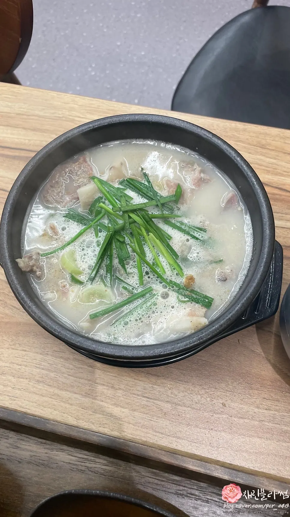A bowl of pork gukbap generously filled with meat