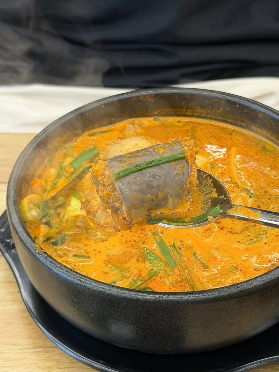 Picking apart the bone soup meat