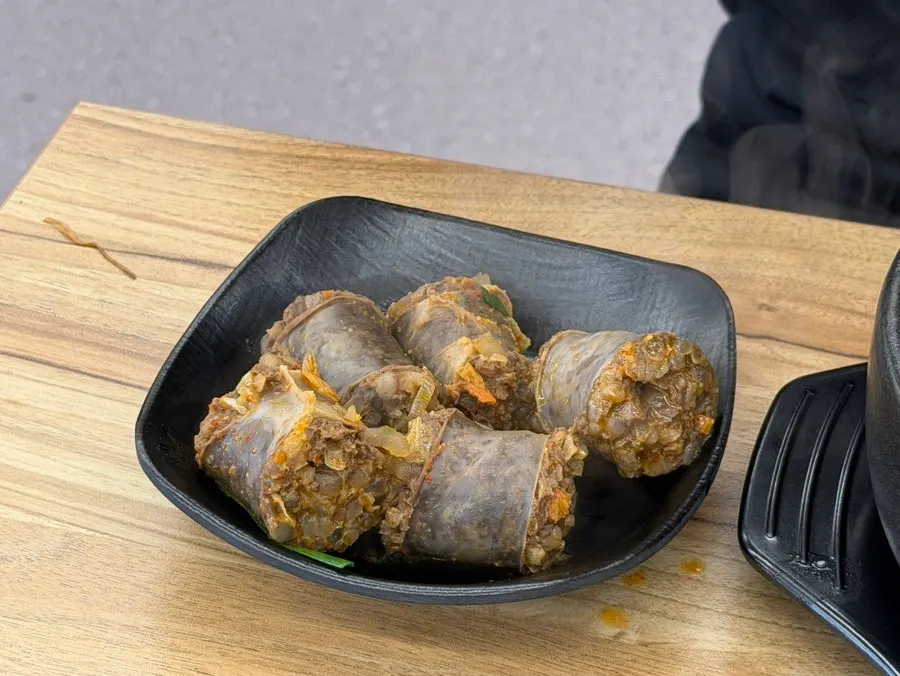 A plate of self-bar garlic pickle and sliced boiled meat