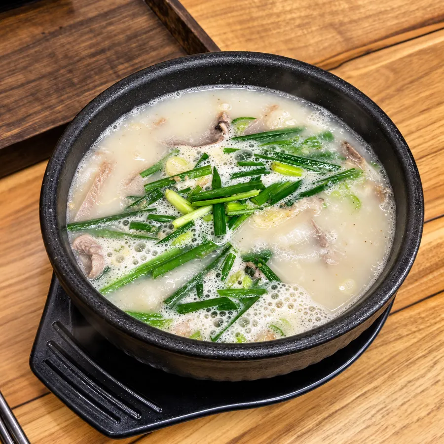 Plain white sundaeguk broth before adding dadaegi