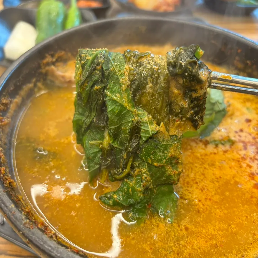 Pork bone hangover soup with wilted greens and perilla leaves