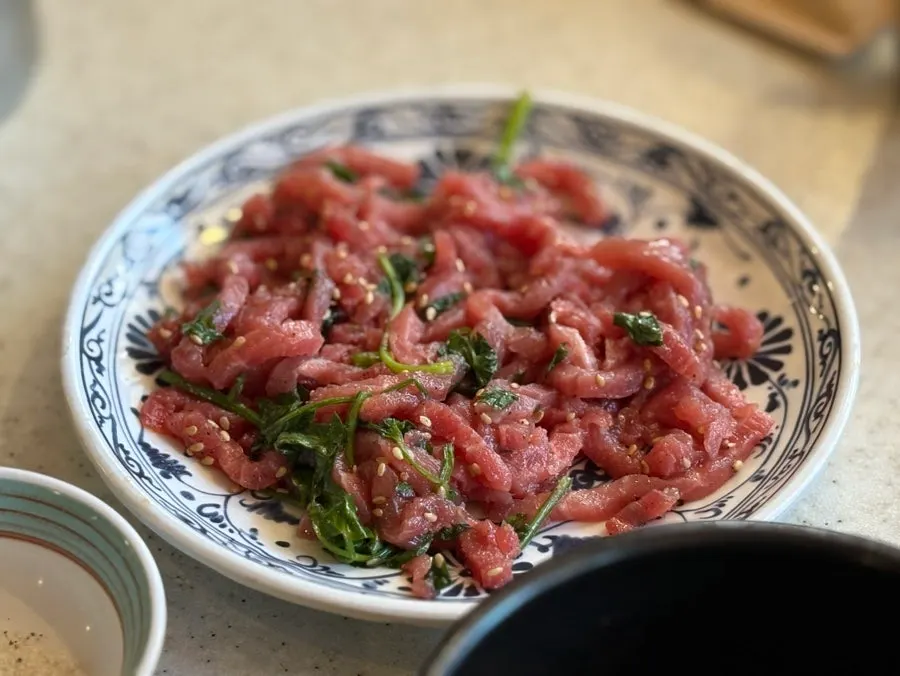 Beef tartare mixed with minari