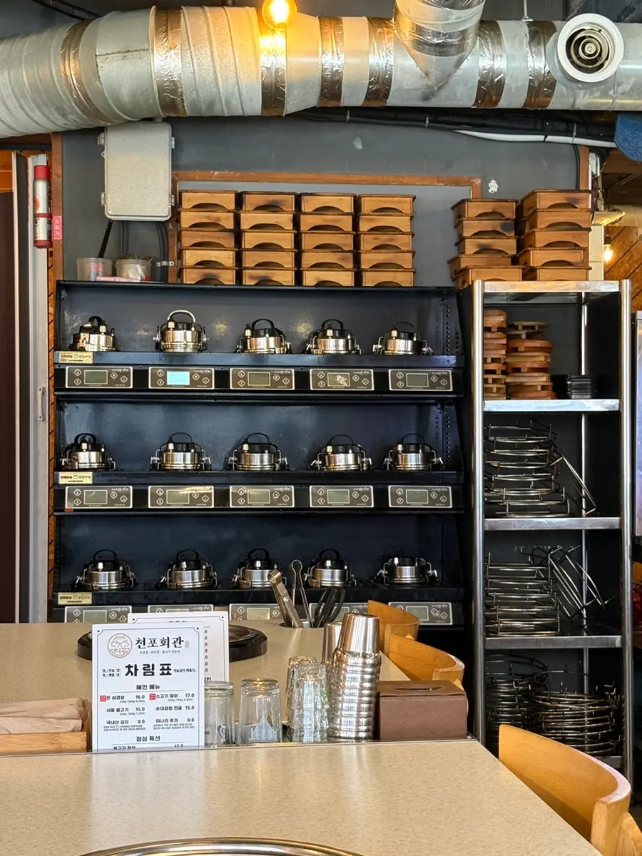 Stone-pot rice cookers along the wall