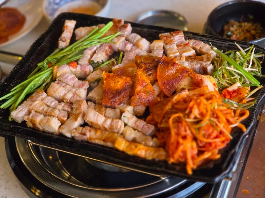 Korean-grown kimchi searing in pork fat