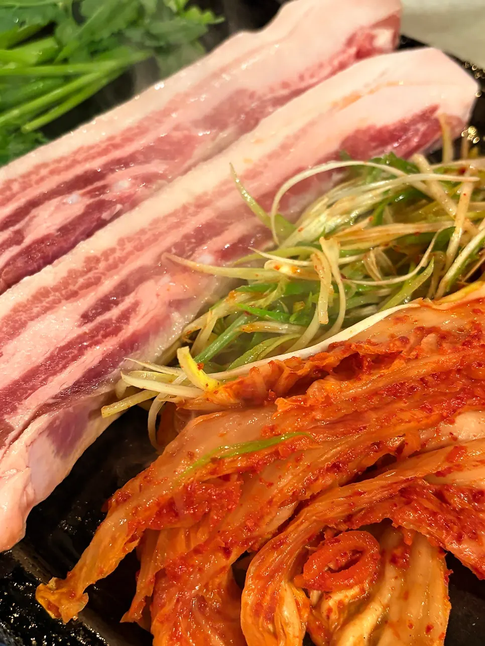 Thick pork belly and kimchi on the griddle