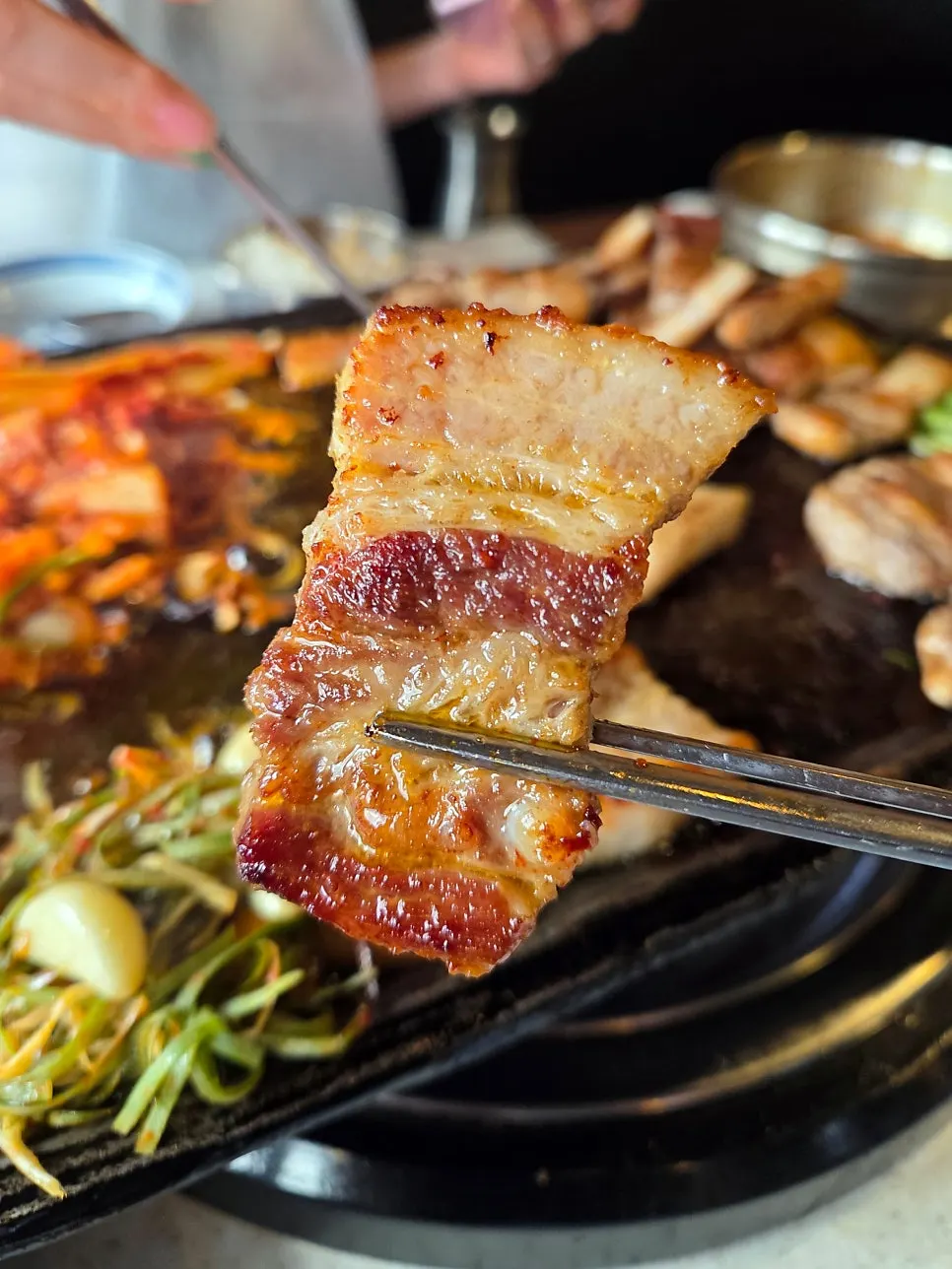 Pork belly sliced into bite-sized pieces grilled with kimchi