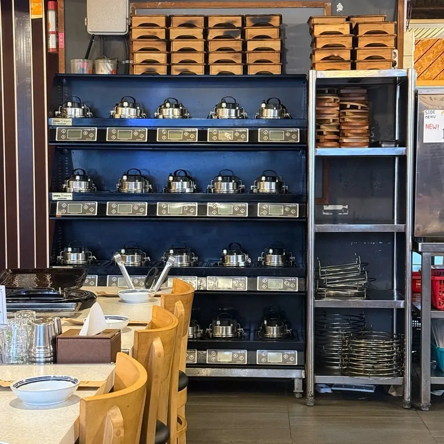 Dining hall seating and reservation notice at Cheonpo Hoegwan