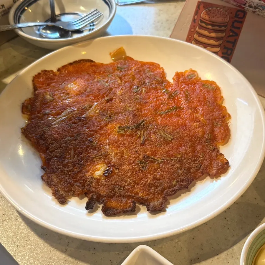 A golden-brown minari kimchi pancake