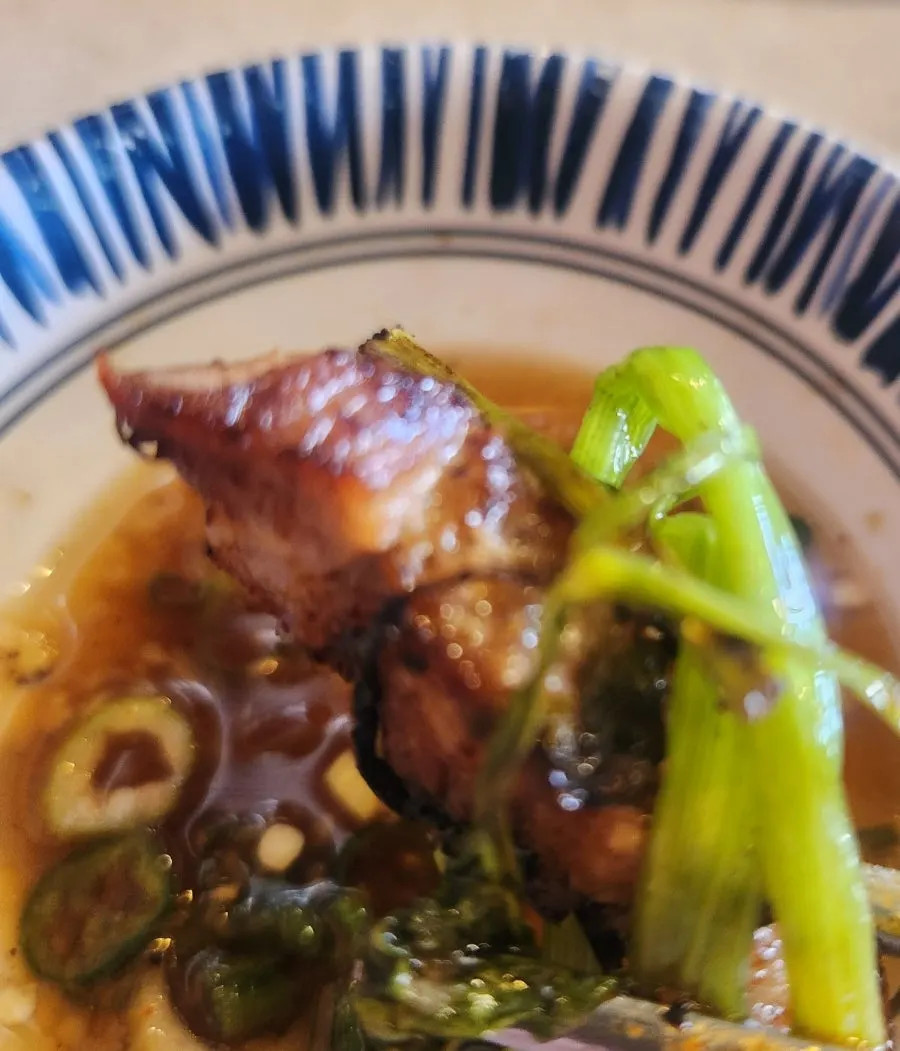 The final grilled pork belly with kimchi and minari