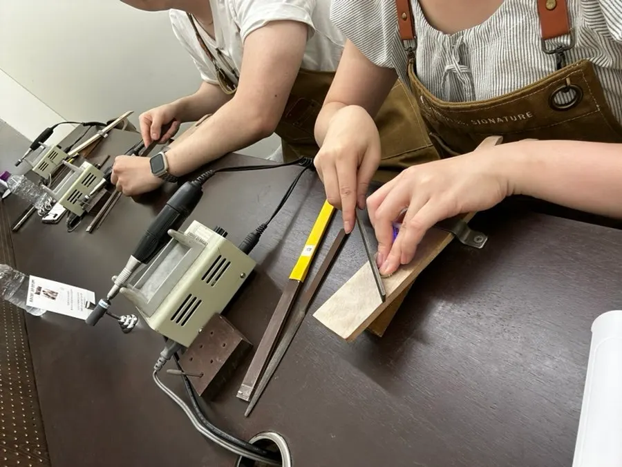 Couple making their own rings separately