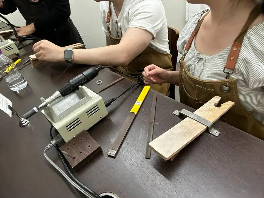 Filing the outside of a silver ring
