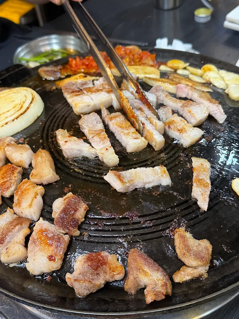 Pork belly placed on the cauldron lid