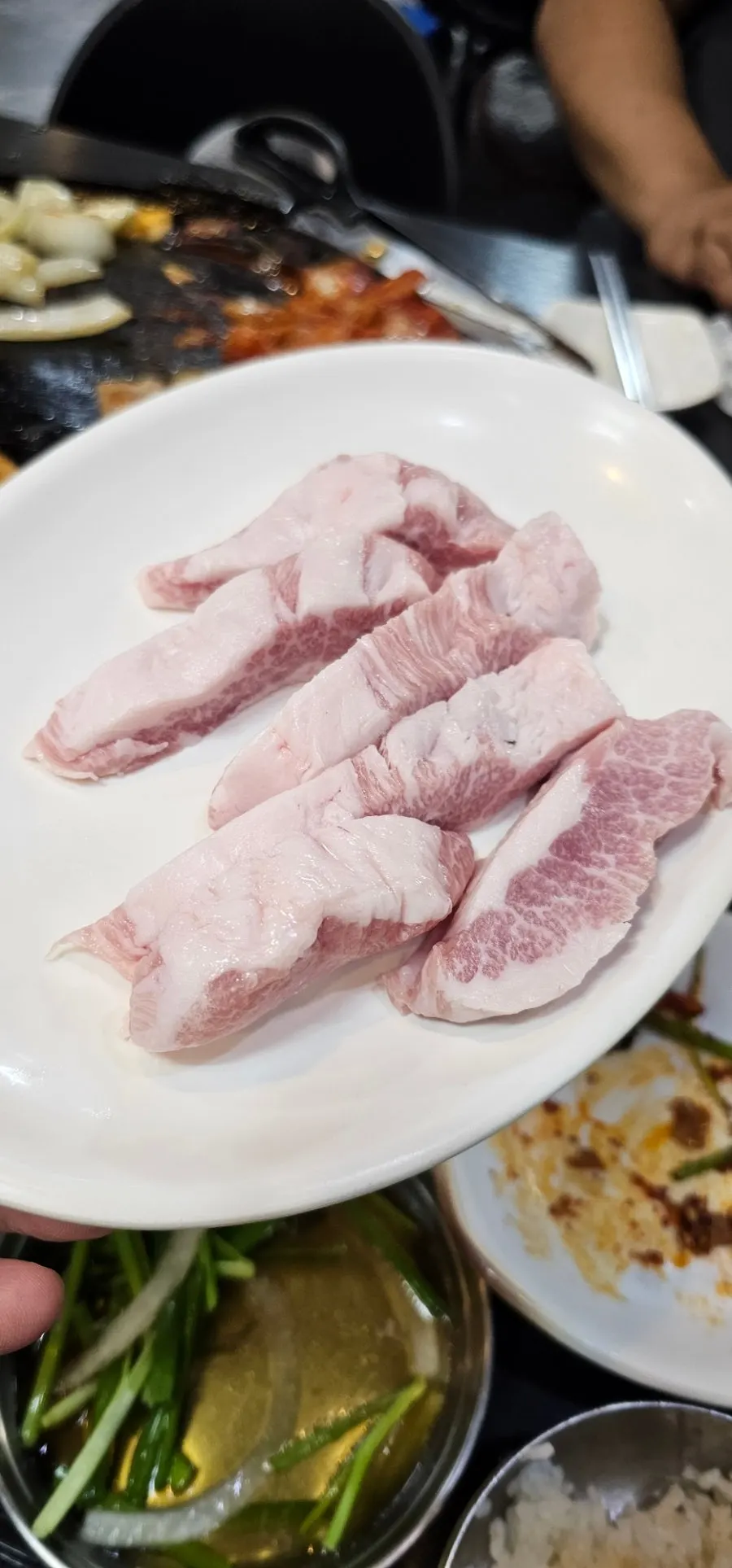 A plate of vividly colored domestic pork skirt meat