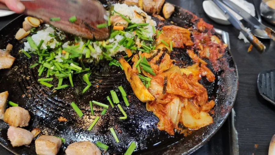 Close-up of kimchi fried rice being cooked