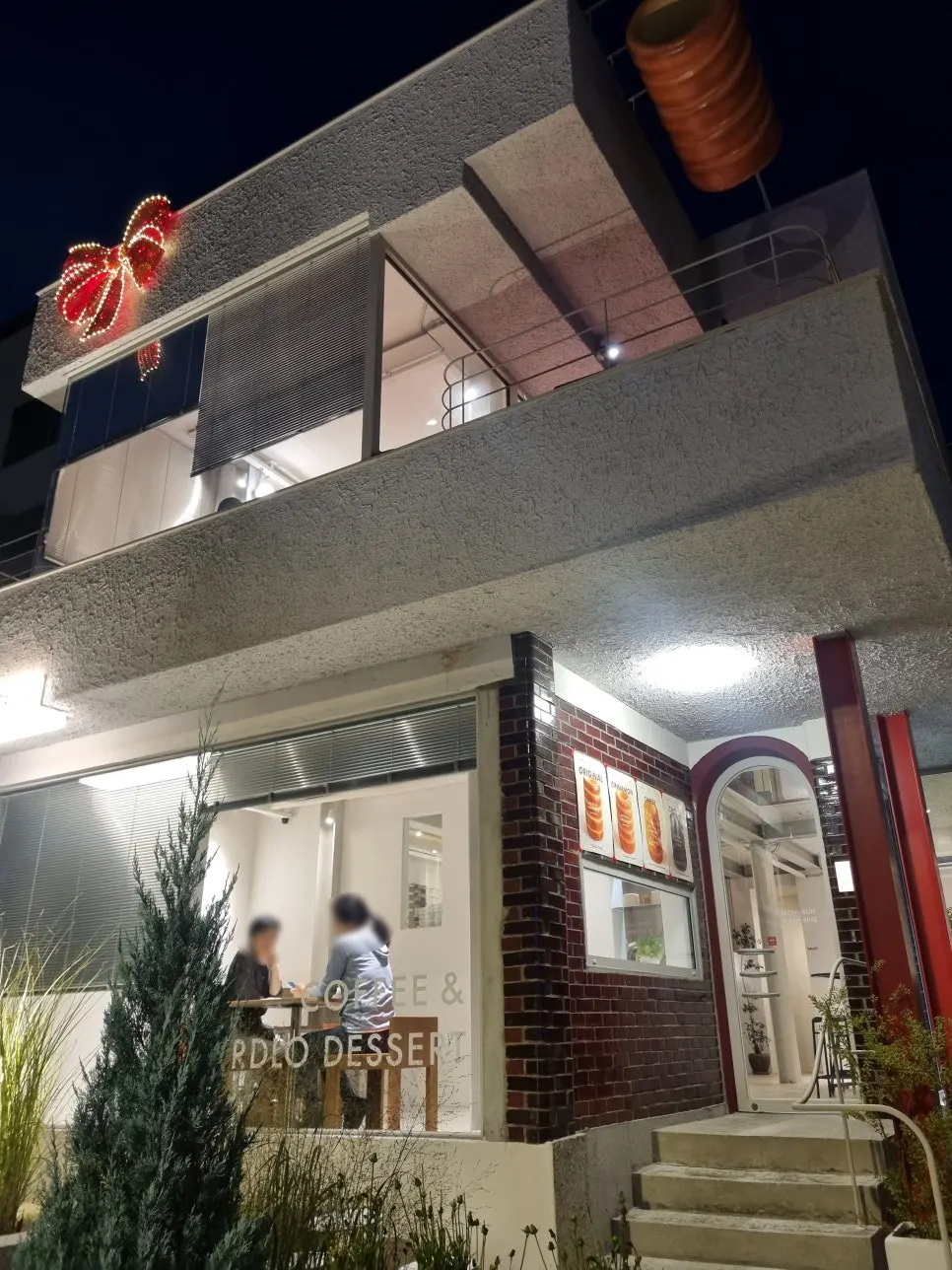 Uisagye's red brick exterior seen at night