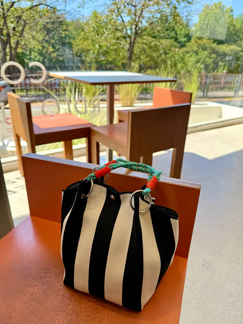 Bag and diary placed on the window table