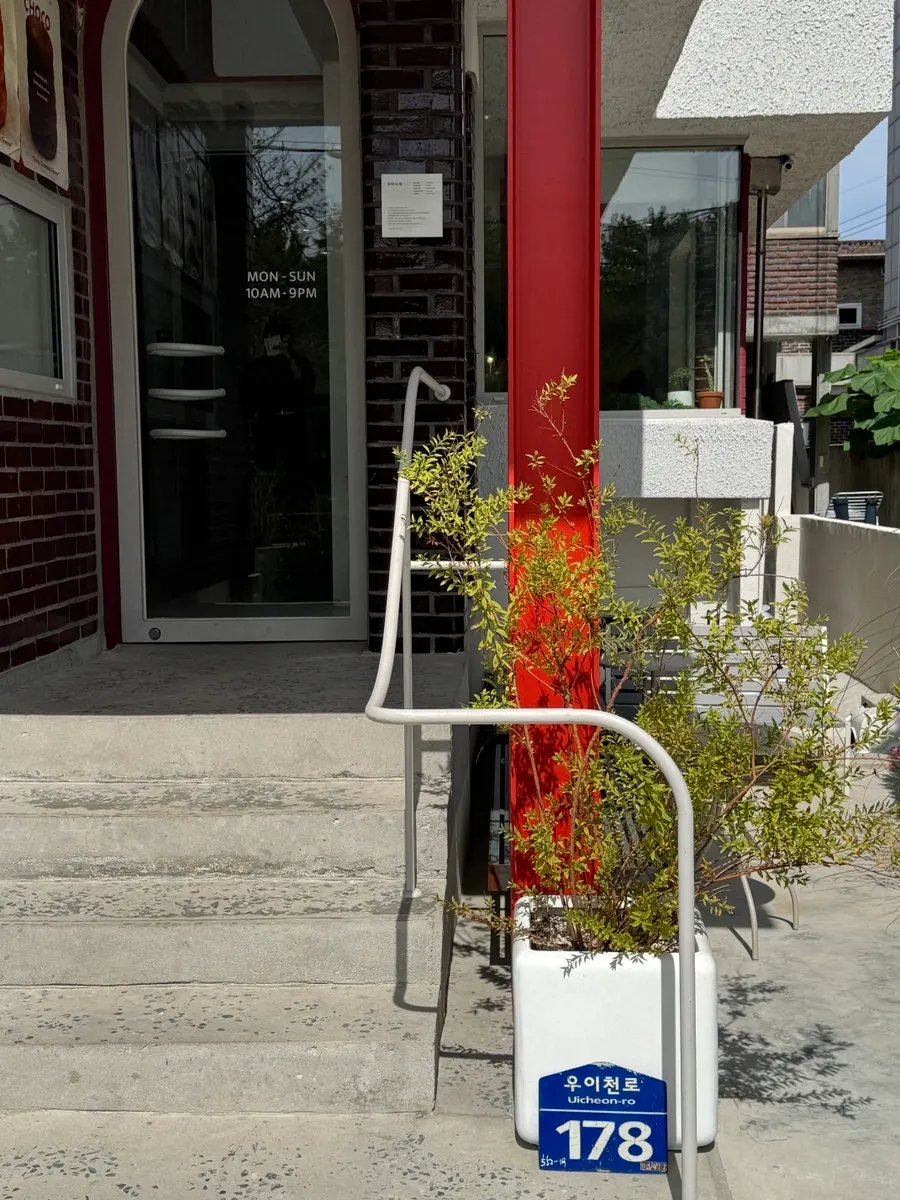 Model of chimney bread hanging on the café exterior