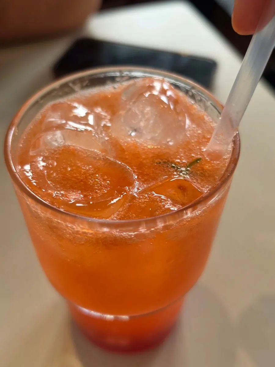 A rich grapefruit ade and a café latte side by side