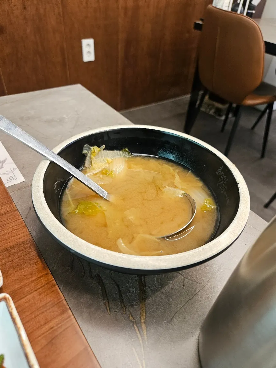 Table spread with doenjang soup and rice pot