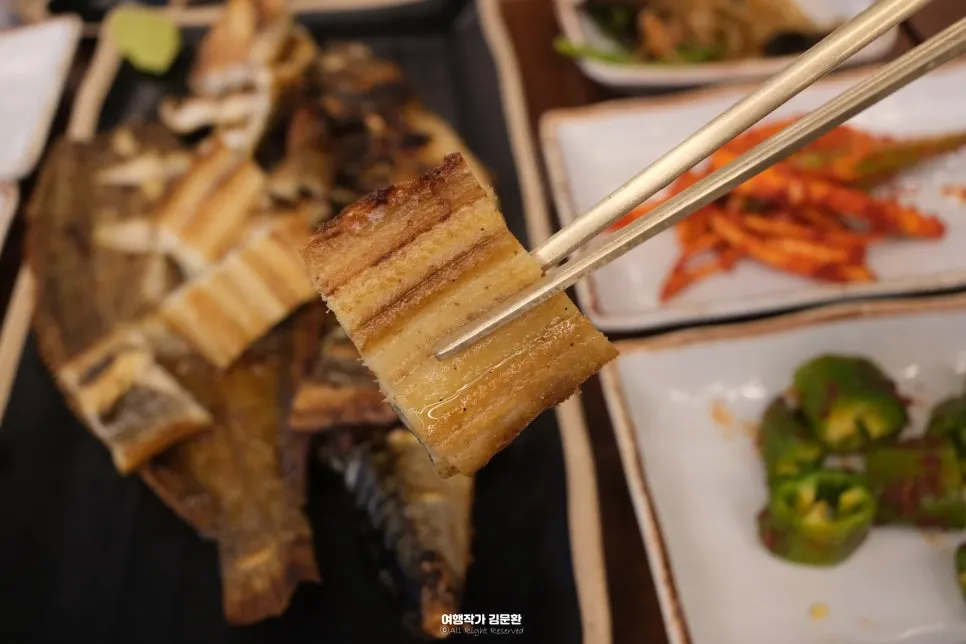 Plates of grilled eel, grilled mackerel, and grilled flounder