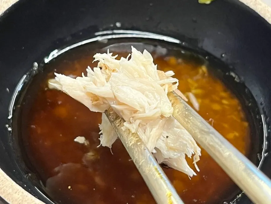A bite of fish placed over rice