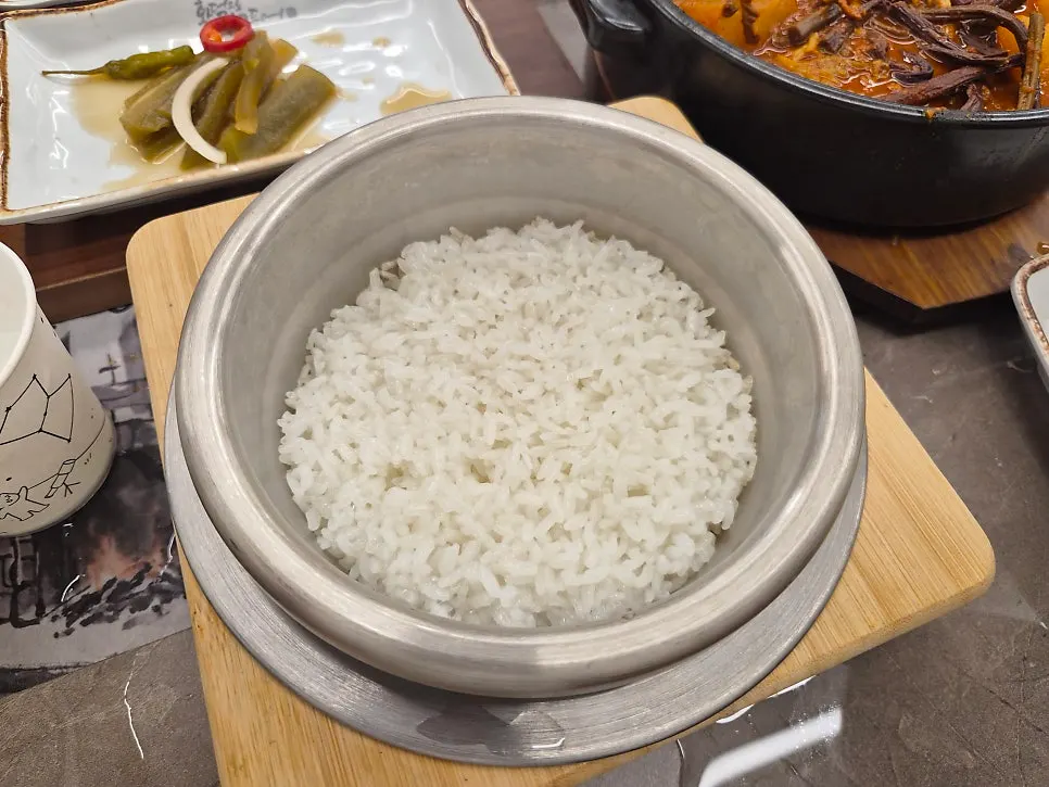 Grilled fish and kimchi on top of rice