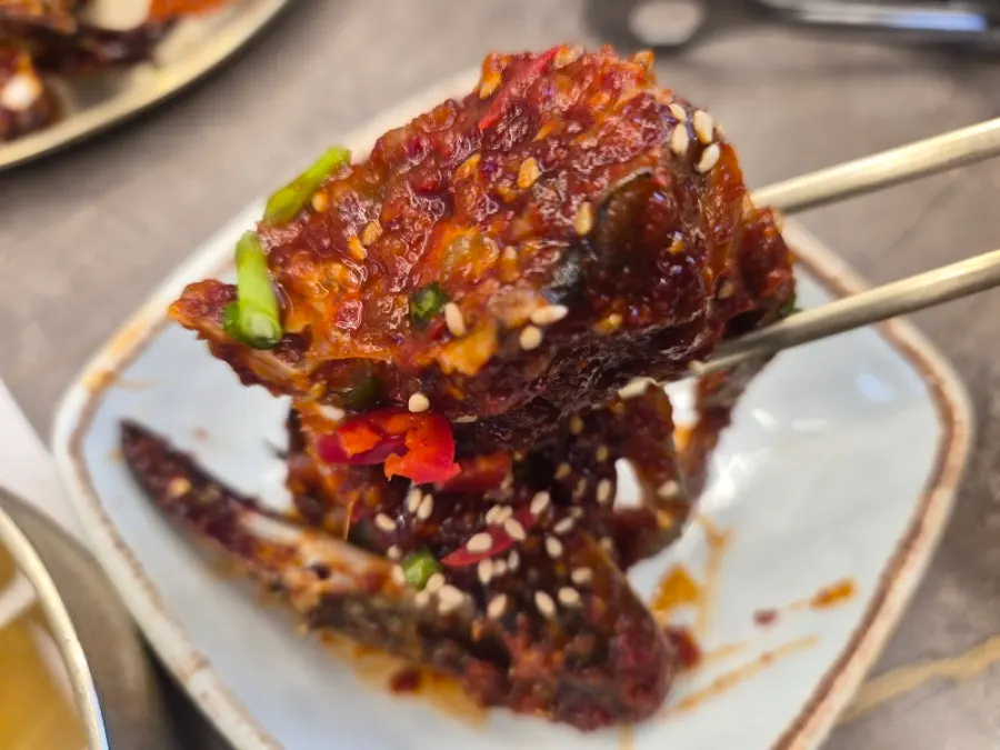 Generous one-person serving of spicy marinated crab