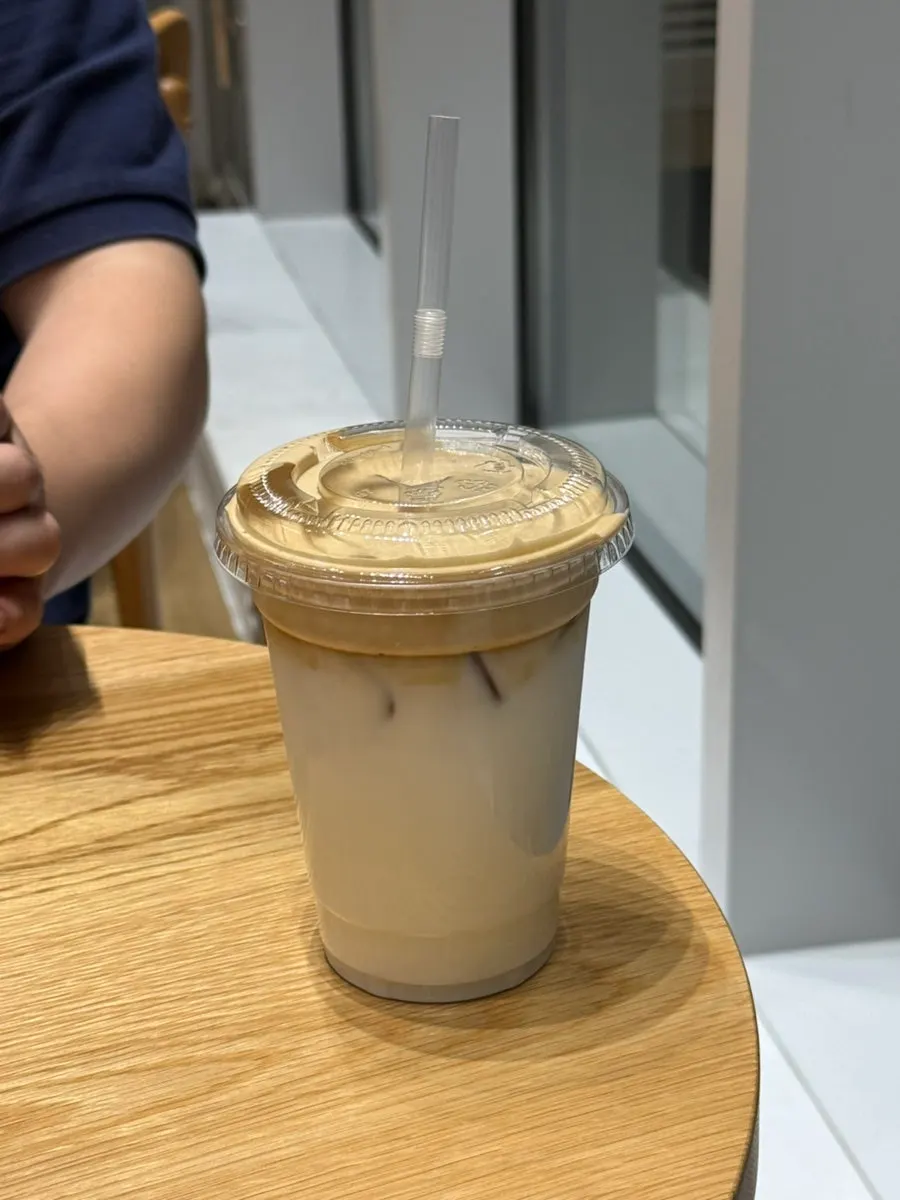 Nearly empty coconut coffee cup