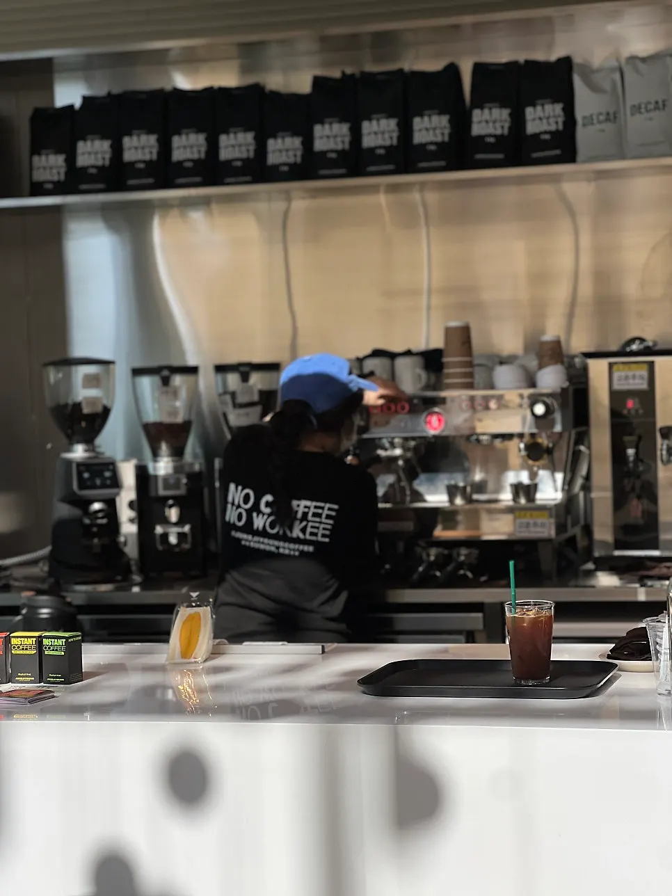 Store decor featuring a coffee-themed phrase