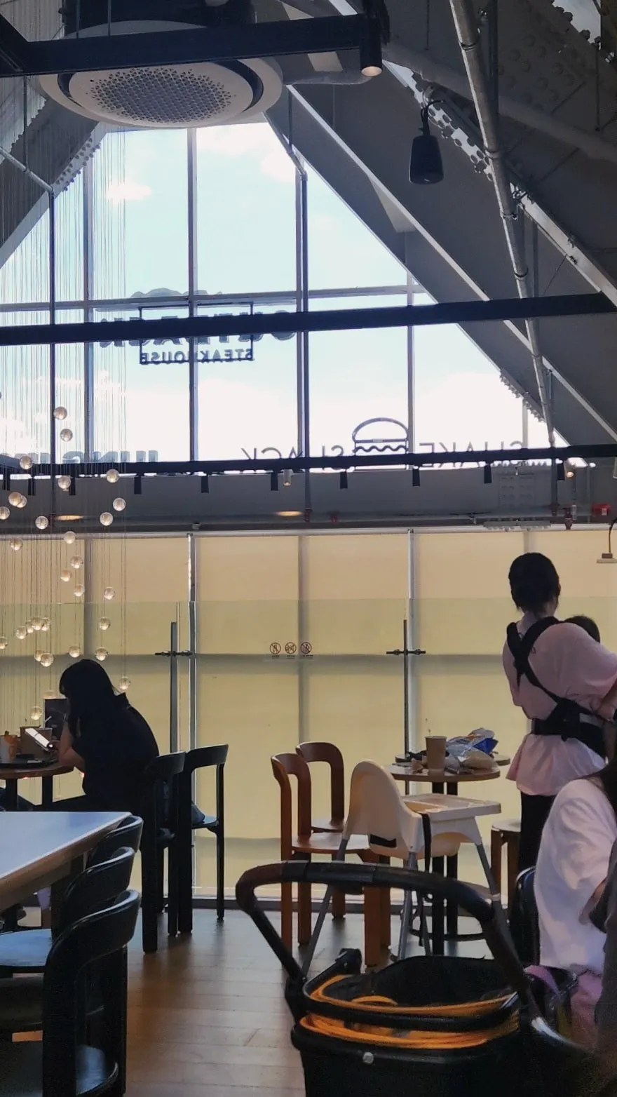 Second-floor tables and round lighting