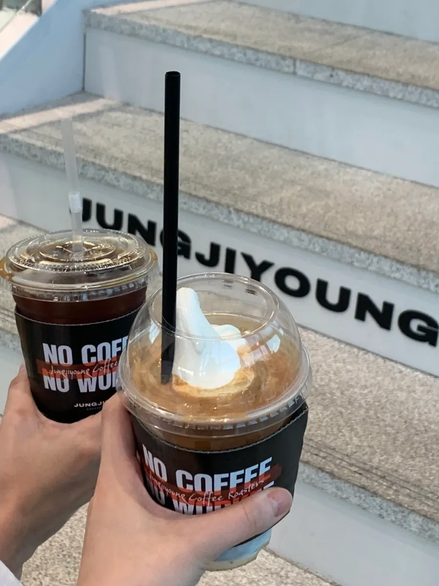 Two takeaway cups of drinks