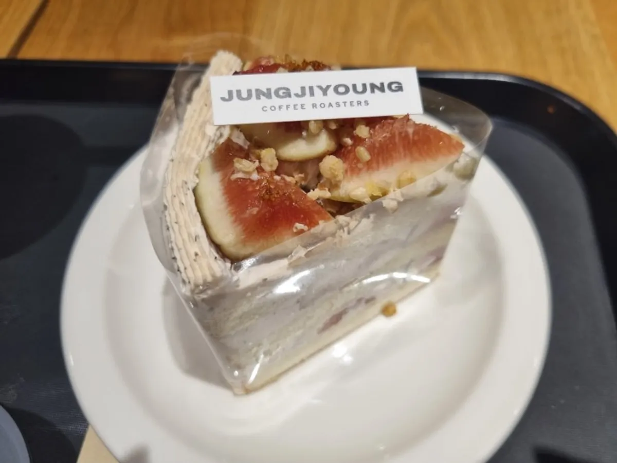 A slice of fig earl grey cake piled high with figs