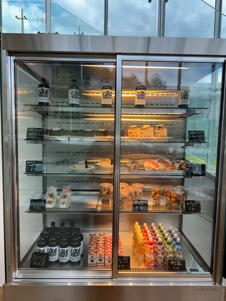 Display of hat and clothing goods, peanut sandwiches, and rusks