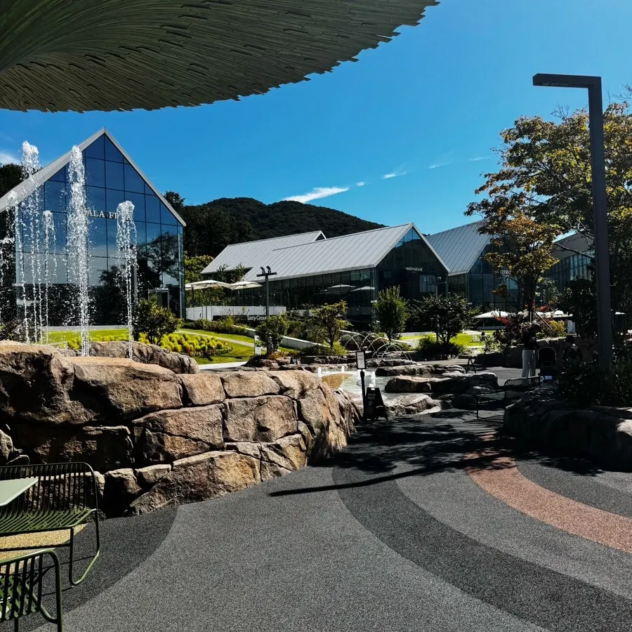 Exterior of the glass café building at the end of Glass Ville