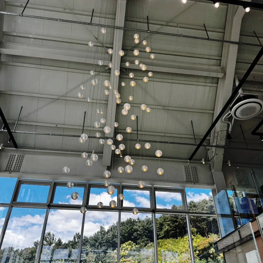 Glass exterior of the café connecting to the lawn