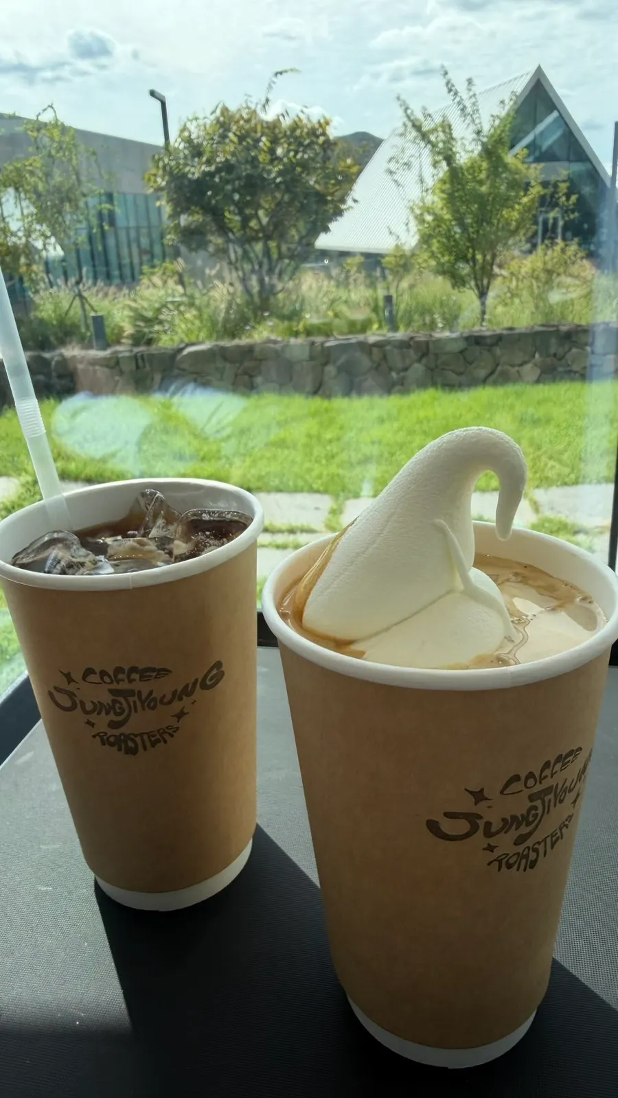 Café scenery beyond the large glass windows