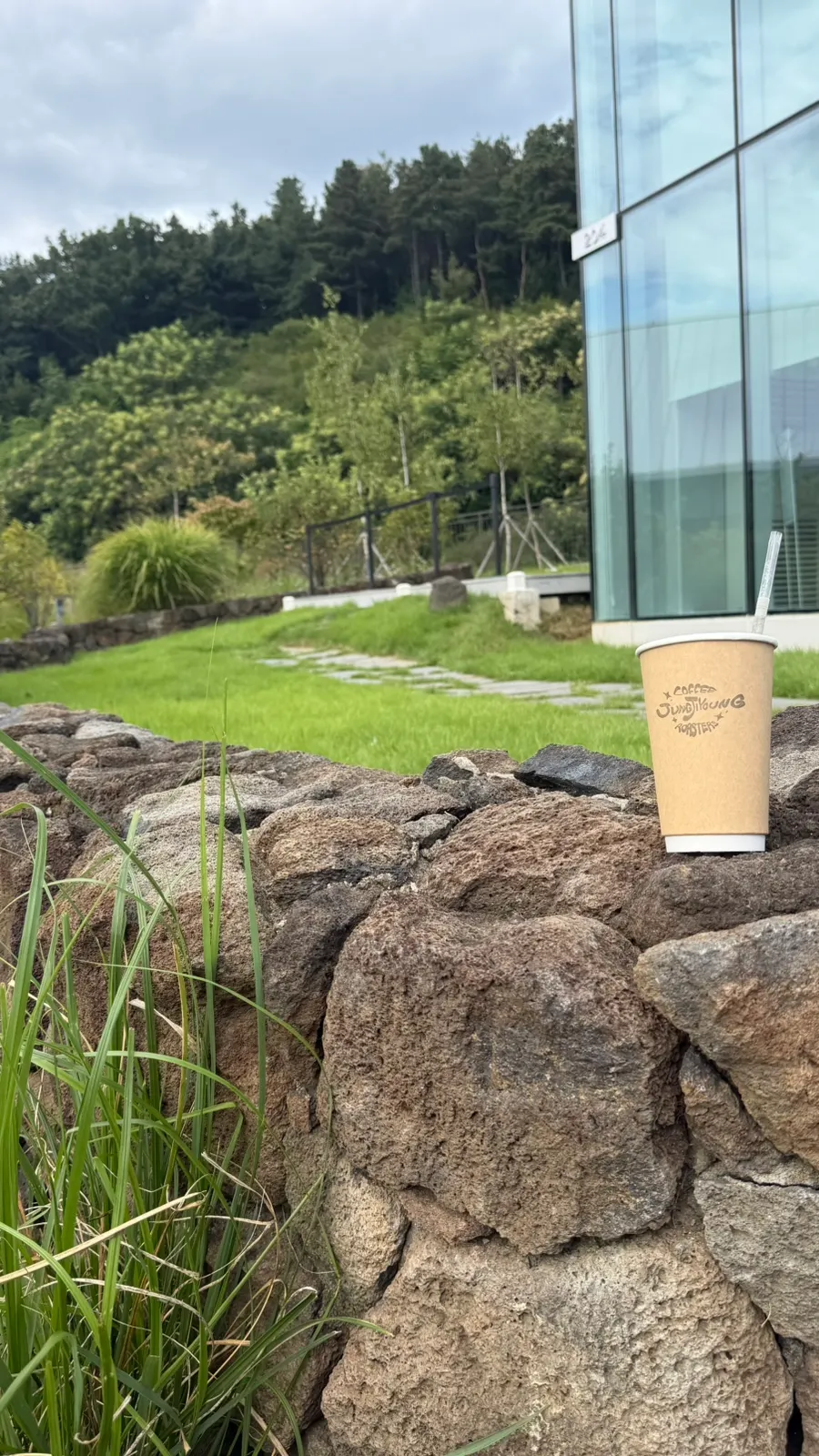 Enjoying a cup of coffee in front of the café