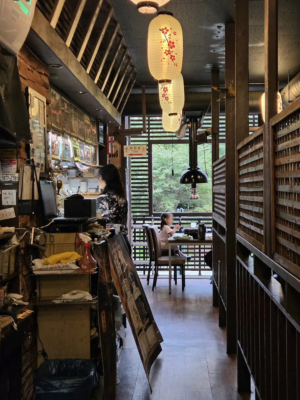 Window seat at Yakiniku Pungyeong with a park view