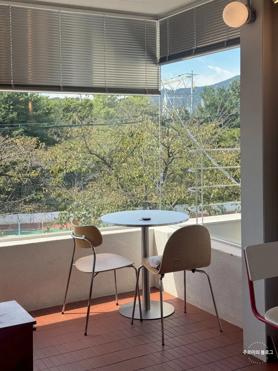Corner table by the second-floor window at Uisagye